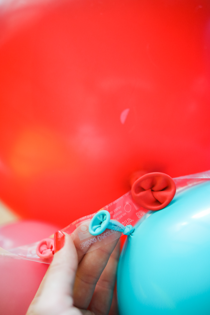 DIY BALLOON GARLAND TUTORIAL featured by top Houston party blogger, Cake and Confetti