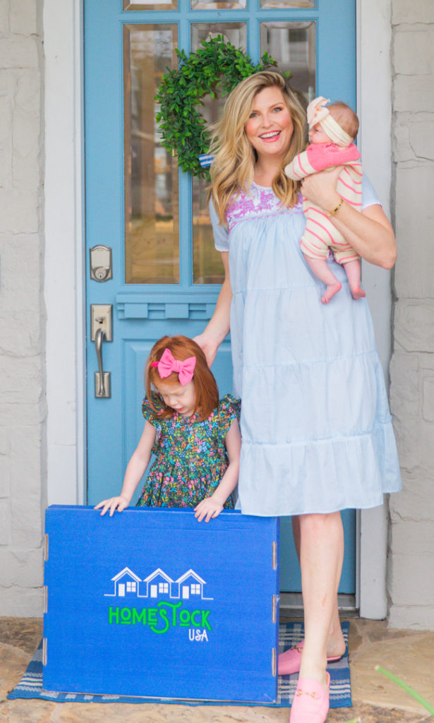 How to Improve Air Quality in Home by popular Houston lifestyle blog, Cake and Confetti: image of a mom and her two young daughters standing together on their front porch with a Homestock USA air filter box. 